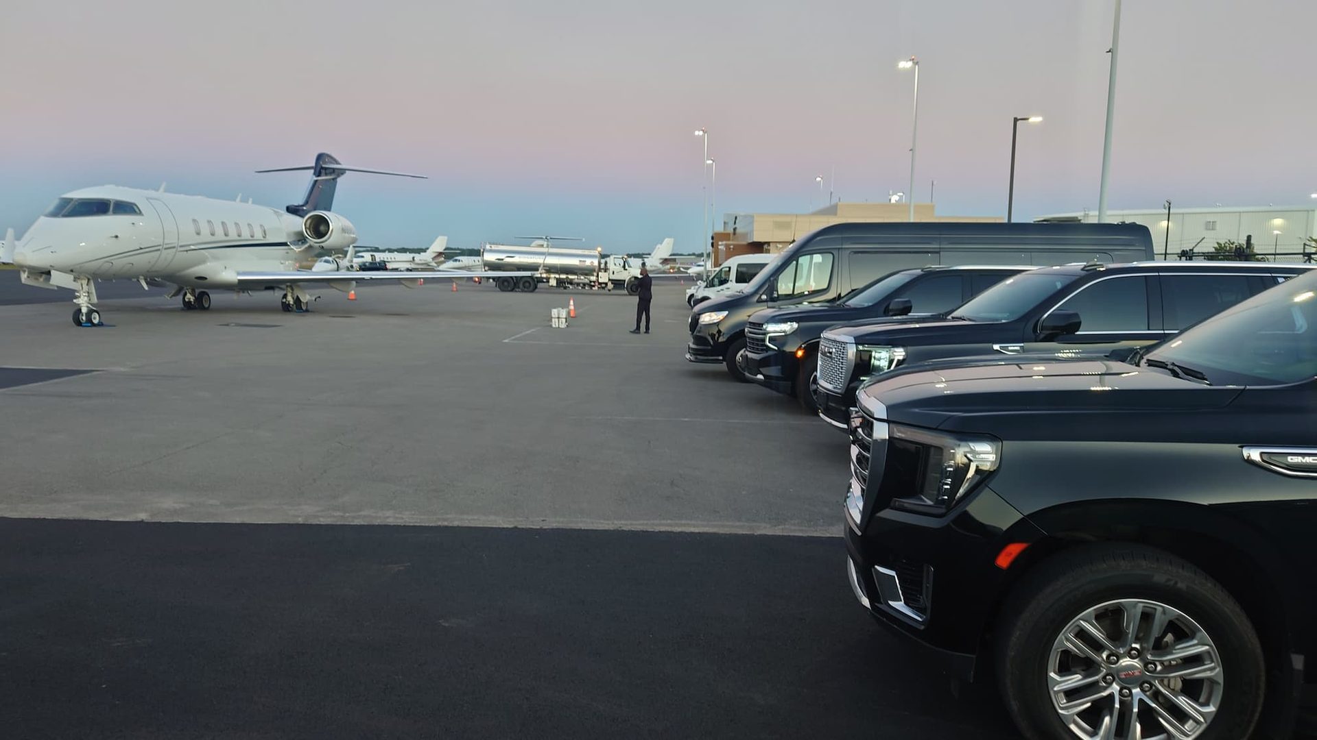 Ambassadors fleet lineup beside a private jet at Signature Aviation BNA